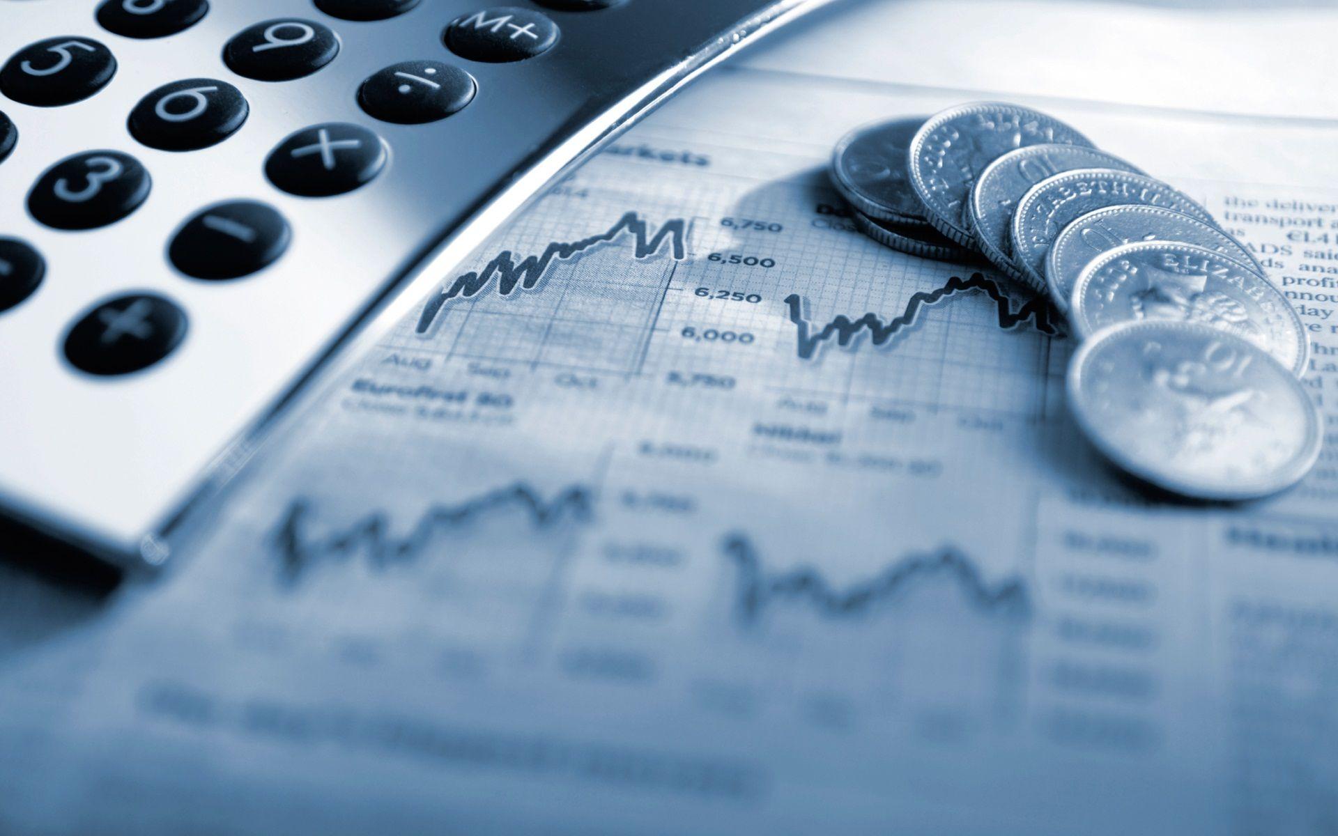 Female finance professional reviewing accounting reports at her desk